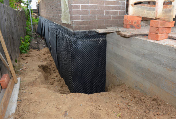 Happy homeowners after waterproofing job in Reisterstown